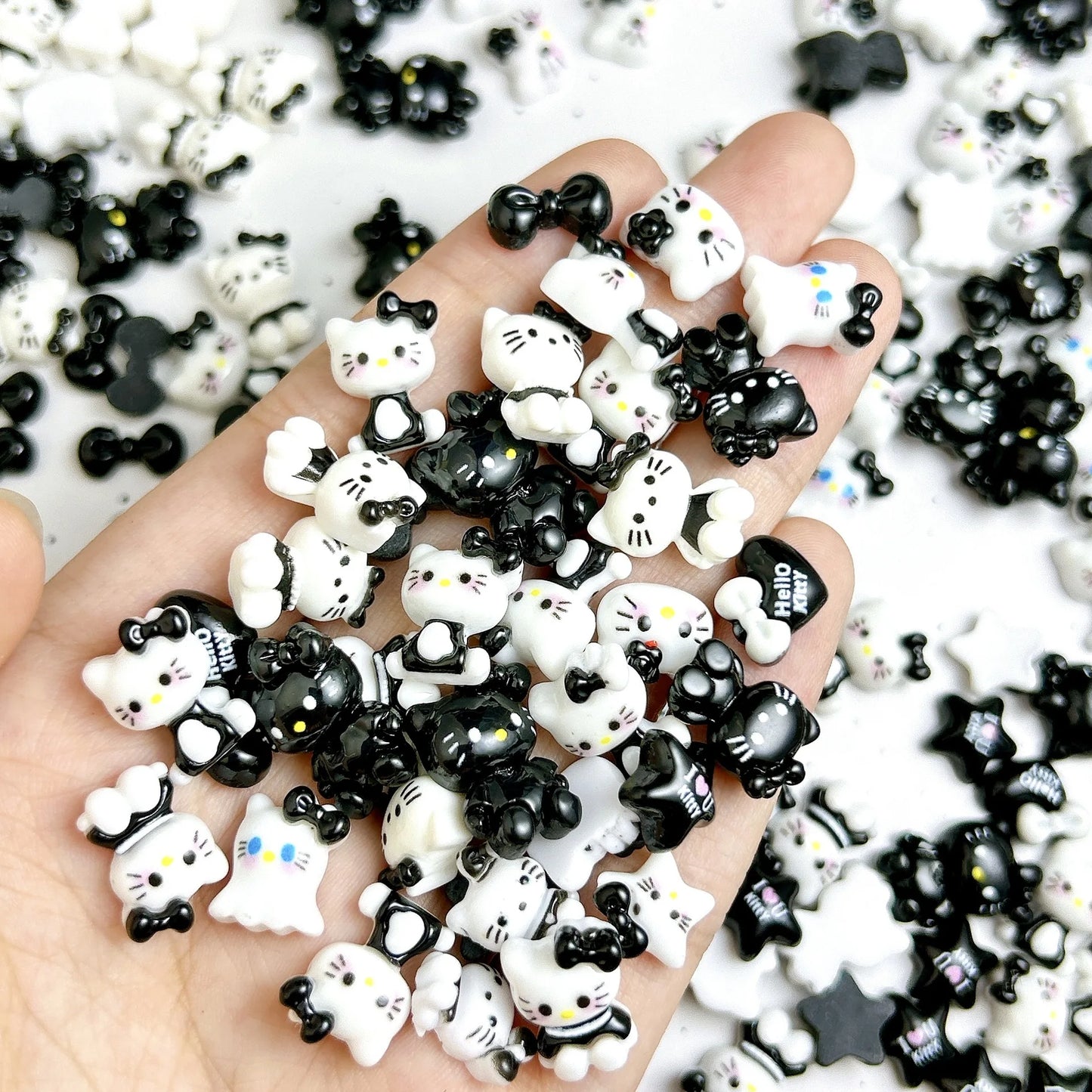 50Pcs Black and White Hello Kitty Nail Charms Cute 3D Heart and Bowtie Nail Art Accessories for a Stylish and Adorable Manicure